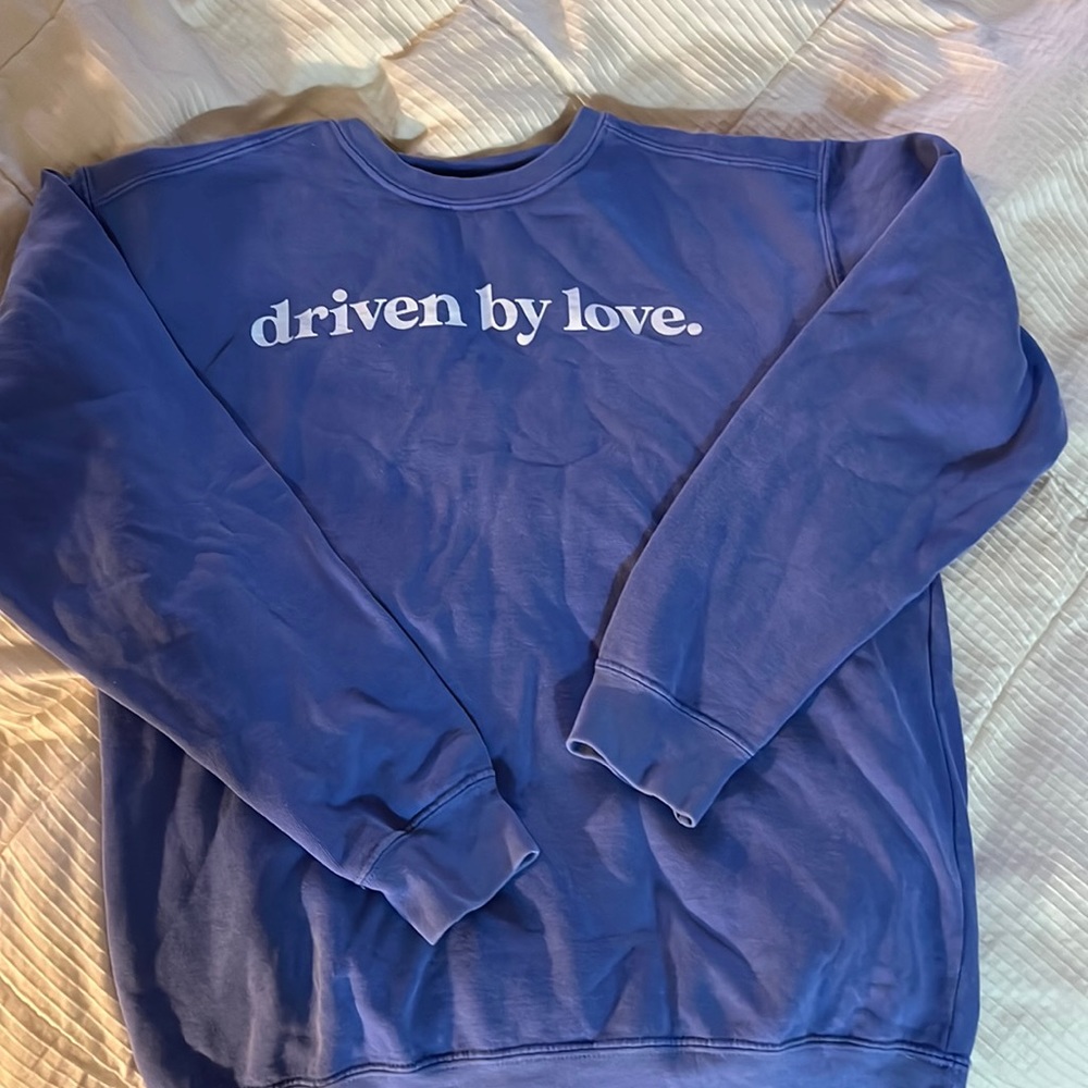 Blue/purple crew neck “driven by love”